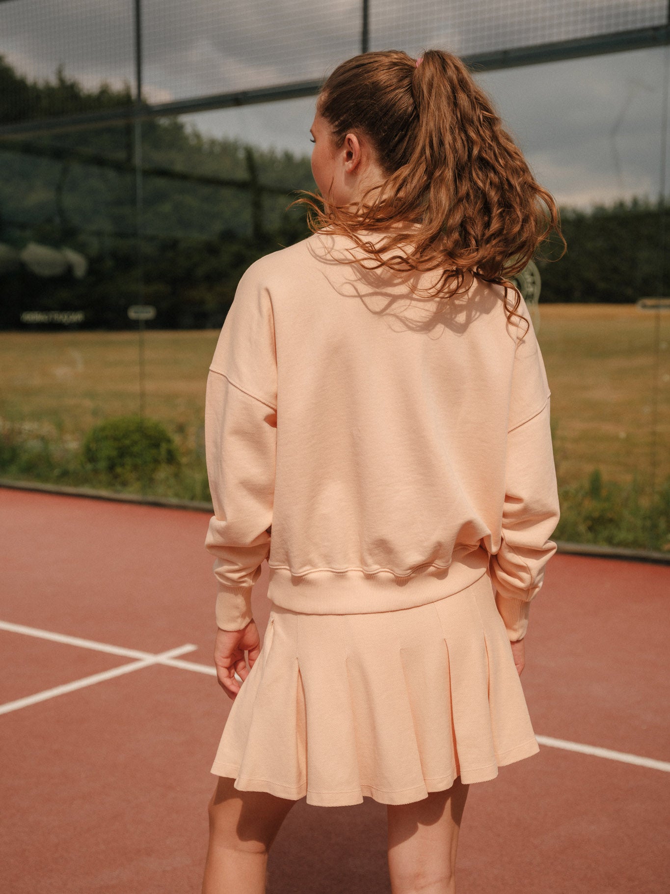 Bandari padel sweatshirt in Faded Peach - women's organic cotton loopback jersey, back view